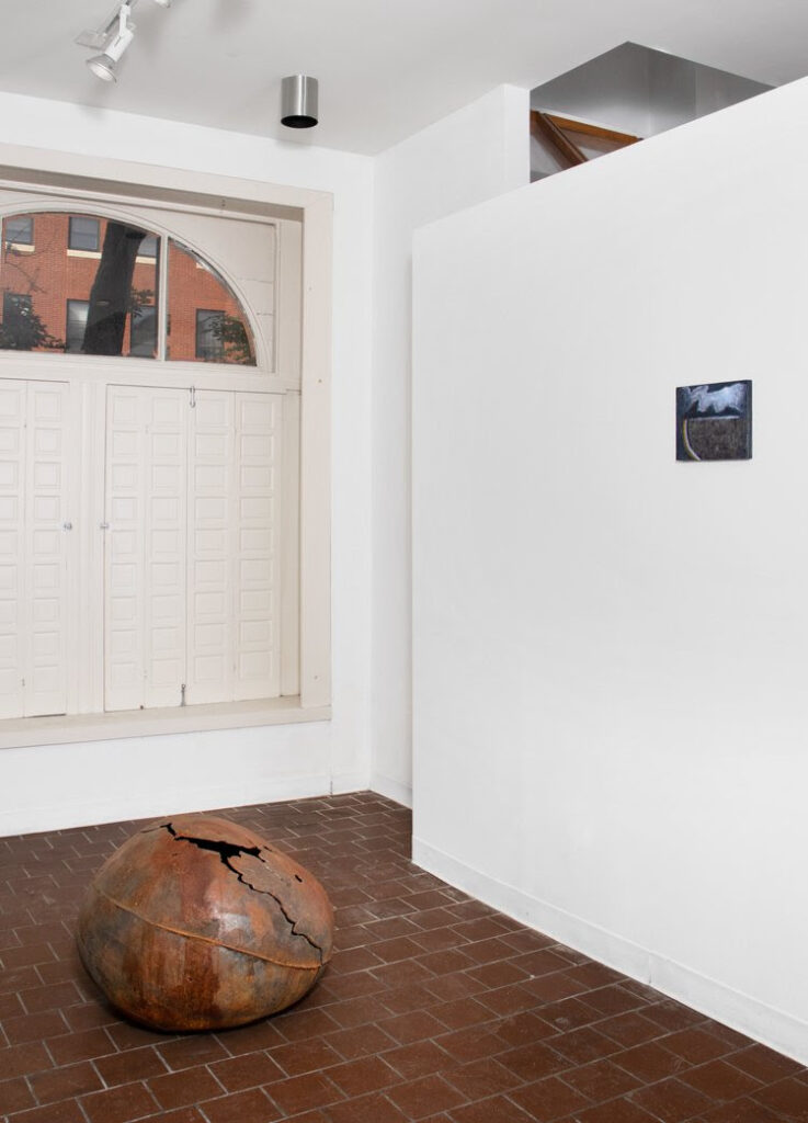 John Ruppert, "Iron Moon Gourd Large #2," 2002, cast Iron, 20 x 28 x 28 inches, and Thiang Uk, "Moon Lit," 2023, oil on panel, 8 x 10 inches